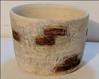 Adorn your home with this one of a kind glazed planter.