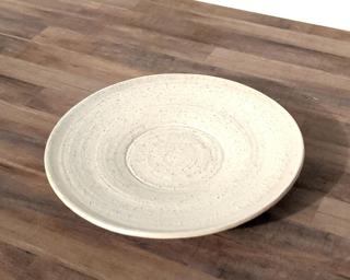 A sweet little dish to keep under your planter.