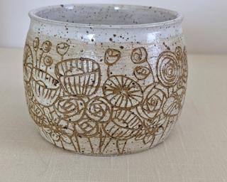 Accentuate your plant collection with this beautiful planter.