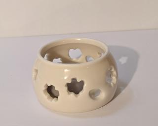 A lovely little summer candle holder for your table. Small cracks at the bottom but still completely functional.