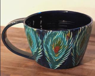 A carefully carved ceramic mug, perfect for a morning latte.