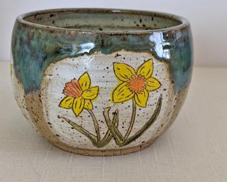 Accentuate your plant collection with this colorful planter.