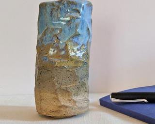 A lovely and unique vase for your shelf.