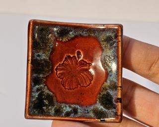 A sweet little red dish for your dresser.