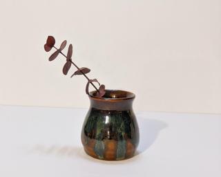 Adorn your home with this one of a kind little drippy vase.