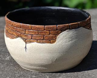 Adorn your home with this one of a kind glazed planter.