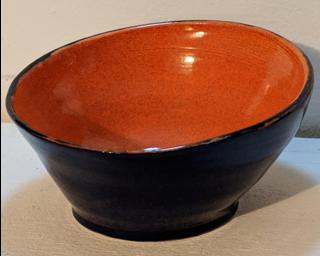 Adorn your home with this deep sapphire blue (exterior) and bright orange (interior) planter.